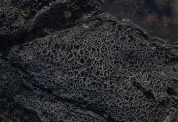 Volcanic rock around around Punta de las Arenas cape on the western part of Gran Canaria, also called Playa de Artenara
