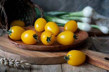 
Yellow cherry tomatoes on a rustic table