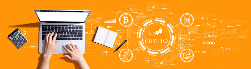 Crypto Trading theme with person using a laptop computer