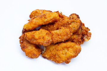 Fried bananas on white background.