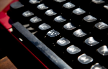 1970s dusty typewriter key V