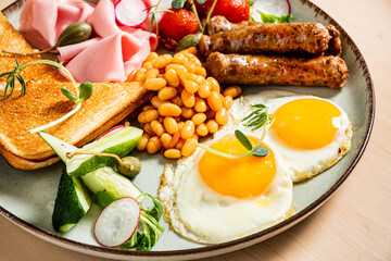 .Download Preview.Share.Add to Likebox.Fried breakfast with bacon, sausages and baked beans