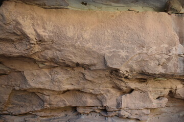 Faded pictographs on a canyon wall