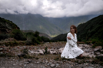 Amazing view of mountains and forest. Lady in white in nature. 