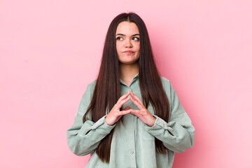 young adult woman scheming and conspiring, thinking devious tricks and cheats, cunning and betraying