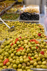 Assortment of pickled green olives on farmers market in Malaga, Andalusia, Spain