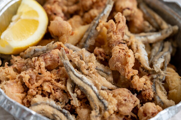 Spanish sea food, cripsy deep fried baby octopus, fish, calamari rings served with lemon