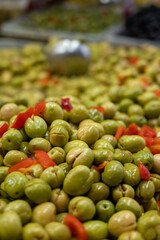 Assortment of pickled green olives on farmers market in Malaga, Andalusia, Spain