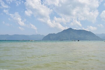 The view of the beach with a very beautiful small island
