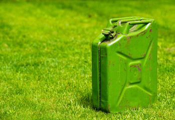 
green fuel container on green grass