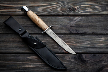 Hunting knife with wooden handle and black leather sheath. Damascus steel blade. Vintage wooden...