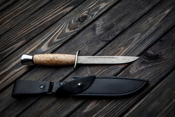 Hunting knife with wooden handle and black leather sheath. Damascus steel blade. Vintage wooden...