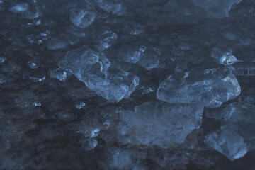 Abstract background in the form of pieces of ice. dark background.