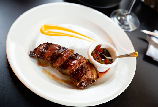 Traditional Argentine rump steak - roasted tail of rump from Angus beef with vegetable sauce..