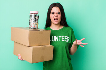 young adult woman looking angry, annoyed and frustrated. donation concept