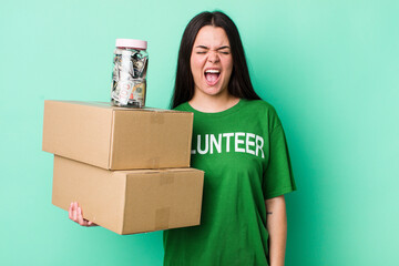 young adult woman shouting aggressively, looking very angry. donation concept