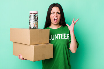 young adult woman screaming with hands up in the air. donation concept