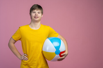 Guy with inflatable ball looking at camera