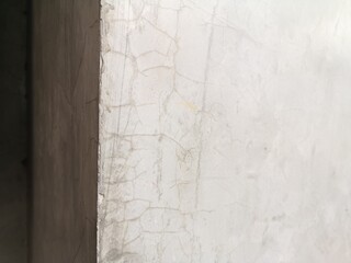 old texture crack on cement​ wall, abstract​ background​ grey color