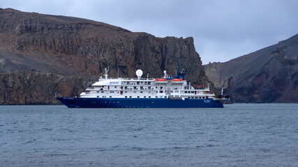 Expedition cruise ship at Whaler's Bay, Deception Island, Antarctica