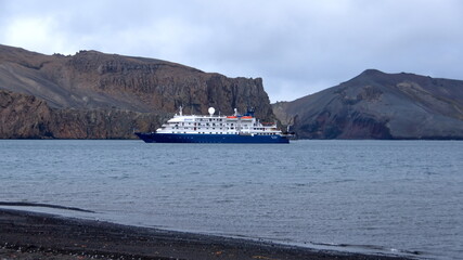 Expedition cruise ship at Whaler's Bay, Deception Island, Antarctica