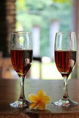 two glasses of red wine on the table