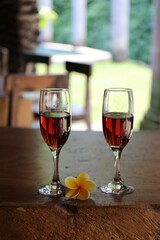 glass of red wine on a table in the summer