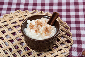 traditional sweet from the Brazilian June festivals, made of white corn with coconut and condensed milk and sprinkled with cinnamon