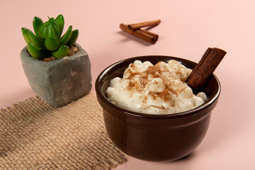 traditional sweet from the Brazilian June festivals, made of white corn with coconut and condensed milk and sprinkled with cinnamon