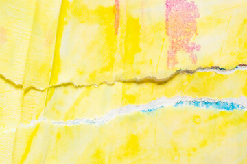 Abstract blue yellow watercolor paint on torn paper background texture
