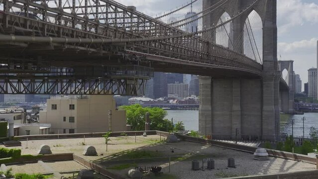 alt rising from Dumbo to view of Brooklyn Bridge and NYC skyline
