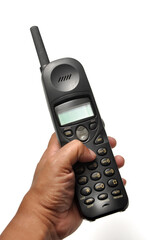 Holding cordless telephone or portable telephone white background