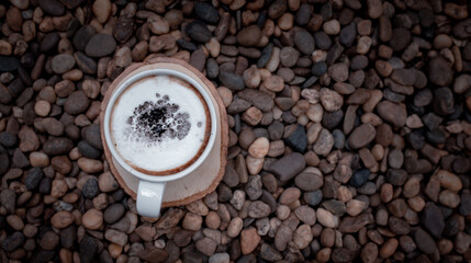 Coffee cup top view with decoration art foam on old wooden in vintage café style