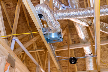 Ventilation pipes in insulation material on the attic the house air ventilation and cleaning system