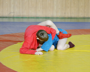 Two young athletes compete in sports wrestling 