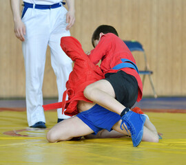 Two young athletes compete in sports wrestling 