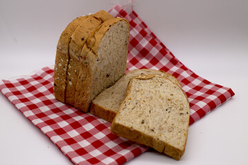 Whole grain bread on a red checkered cloth,Include Clipping Path.