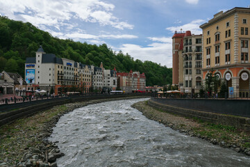 Krasnaya Polyana, Sochi, Krasnodar Krai, Russia, 05.06,2022: View of the embankment of the Mzymta River at the Rosa Khutor ski resort on a summer day