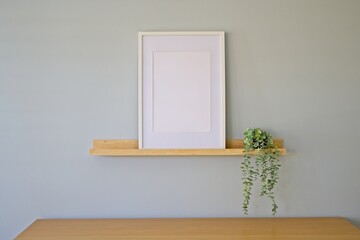 Mockup frame with hanging plant.