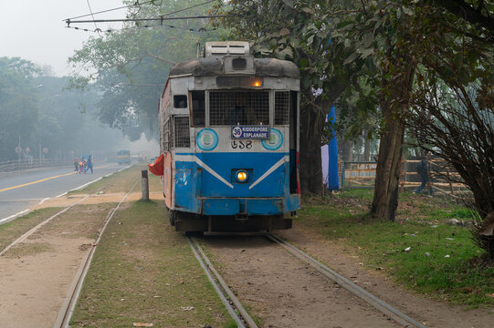 Kolkata, West Bengal, India - 23rd January 2020 : Electric Tram is passing through tram lines at Kolkata maidan area. It is the only tram system operating in India and oldest in Asia, 100 years old.