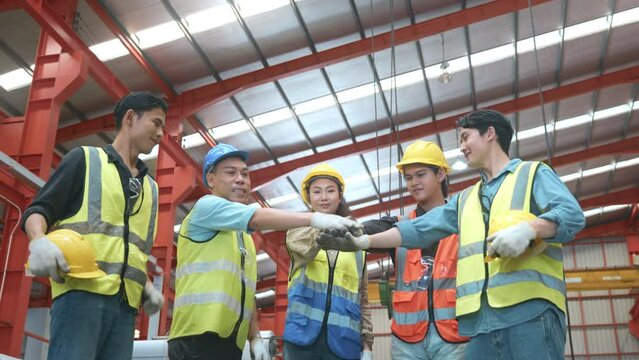 Factory Workers join stacking hand together for collaboration in Metal Sheet factory, Workers hands touching and Join hand for collaboration for successfully, Industrial people and manufacturing labor