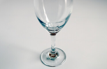 Empty wine glass on a white background
