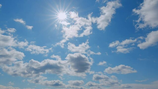 Blue sky white puffy fluffy clouds billow in high space. Sky with clouds weather.