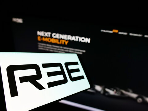 Stuttgart, Germany - 05-20-2022: Mobile phone with logo of Israeli company REE Automotive Ltd. on screen in front of business website. Focus on left of phone display.