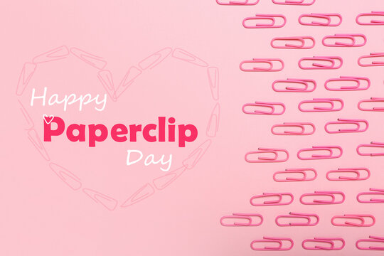 Many paperclips on pink background. Greeting card for National Paperclip Day