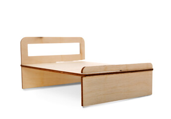 Toy wooden bed on white background
