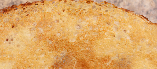 Pan fried pancake as a background.