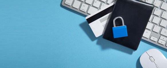 Padlock, credit card on the computer keyboard. Credit card security