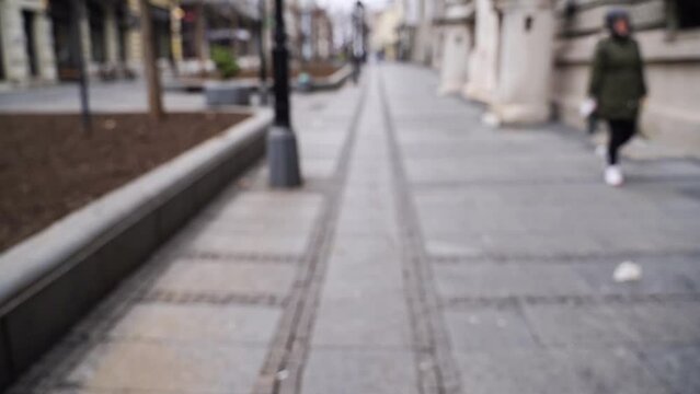 Slow motion blurred video on city street. Urban alley. Empty crosswalk. Social distance concept. Road corner. Lifestyle daytime background. Europe town exterior