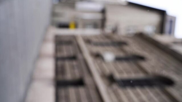 Vertical slow motion blurred video on city street. Urban alley. Empty crosswalk. Social distance concept. Road corner. Lifestyle daytime background. Europe town exterior